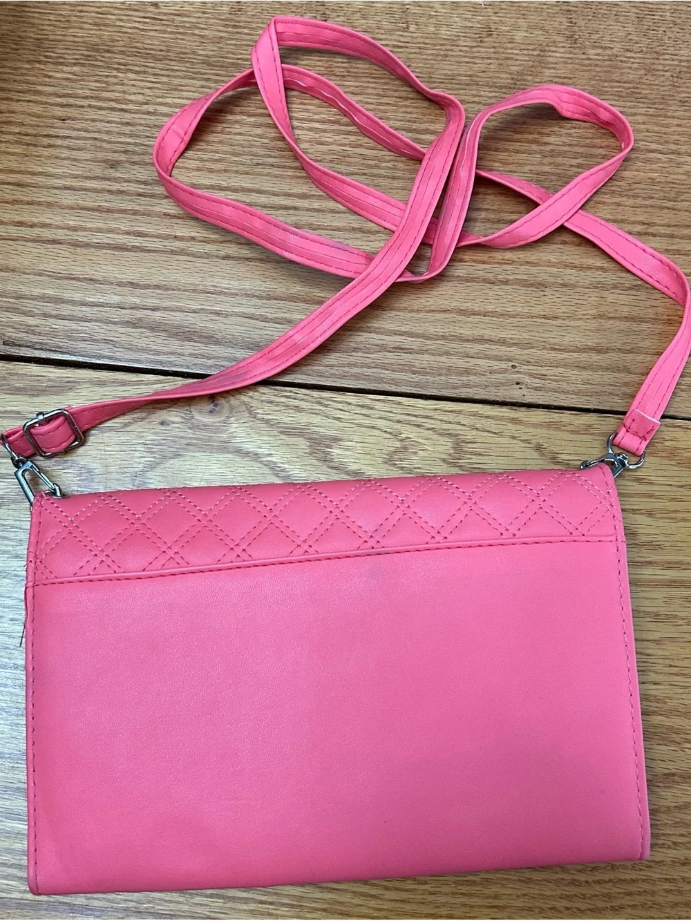 Pink wallet purse with shoulder strap and clasp